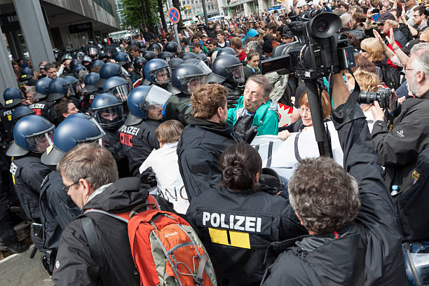 Blockupy 2013, Frankfurt Frankfurt, Germany - June 1, 2013: Protestors and anti-riot police getting into a fight at Blockupy 2013 demonstration in the city center of Frankfurt. Blockupy is a left-wing political network of several organizations. The name derives from its plan for a "blockade" and the Occupy movement. protestors at blockupy 2013 demonstration frankfurt stock pictures, royalty-free photos & images