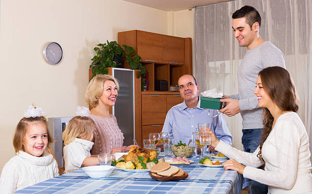 istock Smiling family member receiving present 471548792