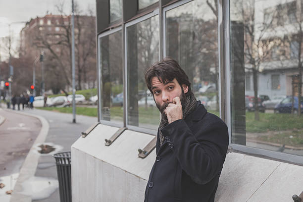 istock Young handsome bearded man posing in the city streets 471548850