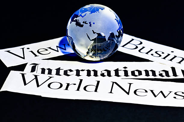 istock crystal globe and newspaper cut outs 471548886