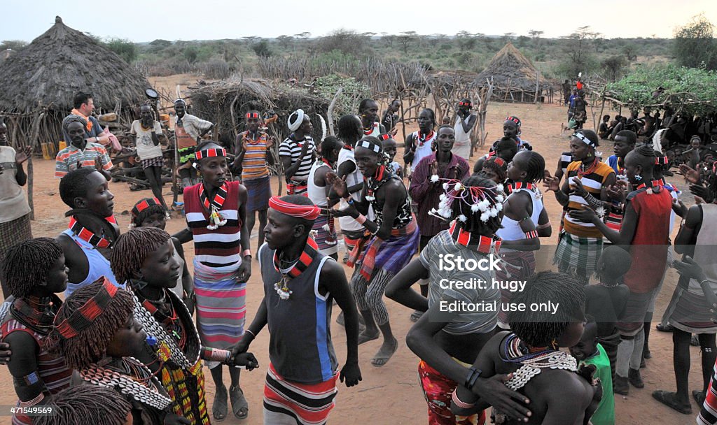 African tribal people Turmi, Ethiopia - February 28, 2012:  African people of the Hamer ethnic group are dancing at the end of the jumping of the bull ceremony near Turmi. Adult Stock Photo