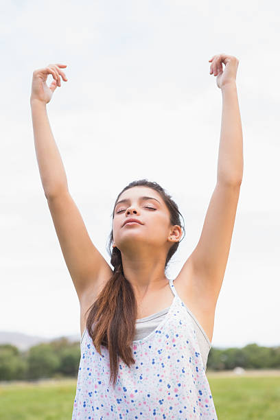 istock Pretty brunette feeling free in the park 471549860