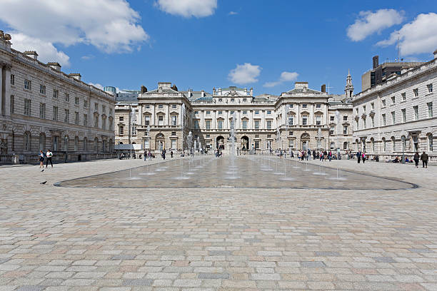 Somerset House London, UK - April 30, 2013: People walking and enjoying the sunshine in the courtyard of the Somerset House in London on a sunny spring day. university of london photos stock pictures, royalty-free photos & images