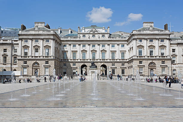 Somerset House London, UK - April 30, 2013: People walking and enjoying the sunshine in the courtyard of the Somerset House in London on a sunny spring day. university of london photos stock pictures, royalty-free photos & images