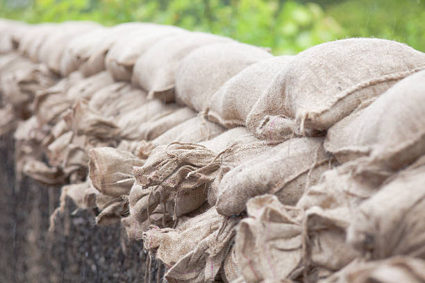 Floodwater sandbags Burghausen, Germany - June 2, 2013: Floodwater sandbags laying in a row to stop the big floodwater in Burghausen. queensland floods stock pictures, royalty-free photos & images