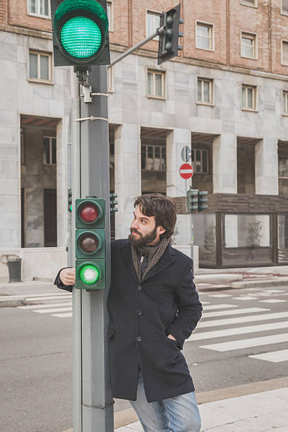 istock Young handsome bearded man posing in the city streets 471551050