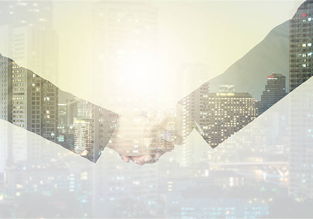 istock double exposure handshake between businessman on a city backgrou 471551090