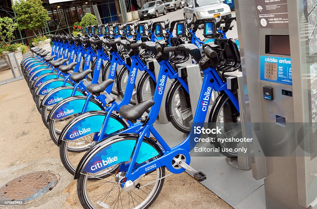 Citi bike New York City, USA - May 25, 2013: Citi Bike station on Broadway and 24th Street near Madison Square Park in New York City, Manhattan, USA. Citi Bike is New York City's bike sharing system. Intended to provide New Yorkers and visitors with an additional transportation option for getting around the city. There is a credit card charge for the use of the bicycle. This image has kiosk for credit card charges in foreground and locked bicycles in background. Bicycle Stock Photo