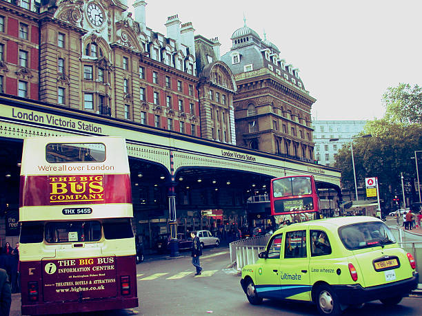 London, United Kingdom- June 1, 2013: urban scene in London, public transport traffic in front of the train station to Victoria Station.