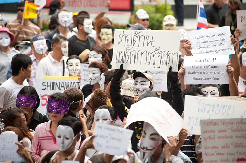 Bangkok,Thailand-June 2,2013 : Unidentified about 700 demonstrators from the anti- government V for Thailand group wear Guy Fawkes masks to protest against the government at the Central World shopping complex on June 2,2013 in Bangkok,Thailand.