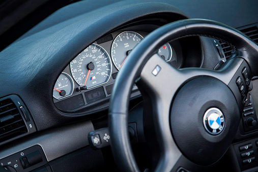 Bedford, Nova Scotia, Canada - June 4, 2013: The interior of a convertible BMW M3 E46 while parked in a parking lot.  Instrument panel in focus with speedometer, tachometer, and gas gauge.  The #46 M3 was first introduced in 2000 and features 333 HP from a 3.2 litre engine.  The BMW M3 is considered one of the best sports cars of all time and is a benchmark in sports performance.