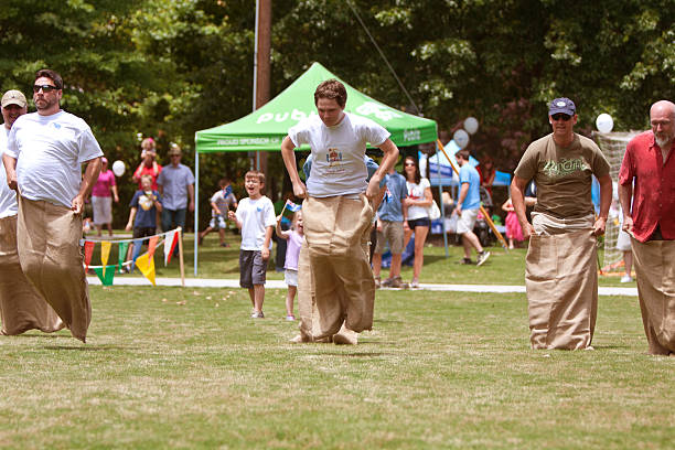 Atlanta, GA, USA - May 25, 2013:  Several unidentified men compete in a sack race at the GREAT festival, a spring festival celebrating Great Britain and the United Kingdom.