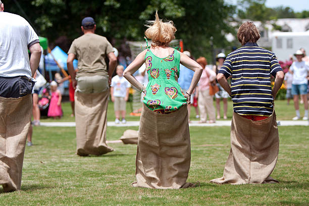 Atlanta, GA, USA - May 25, 2013:  Several unidentified people compete in a sack race at the GREAT festival, a spring festival celebrating Great Britain and the United Kingdom.