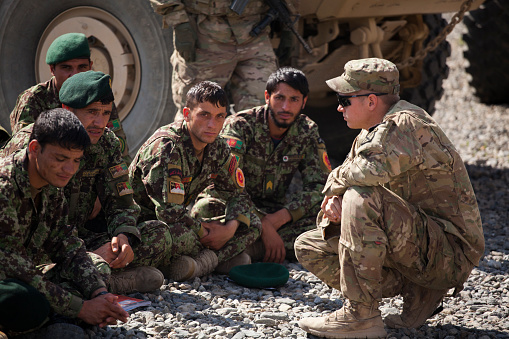 Kabul, Afghanistan - May 6, 2013: A U.S. Soldier speaks to a group of Afghan National Army (ANA) Soldiers, prior to starting a class on the MSFV