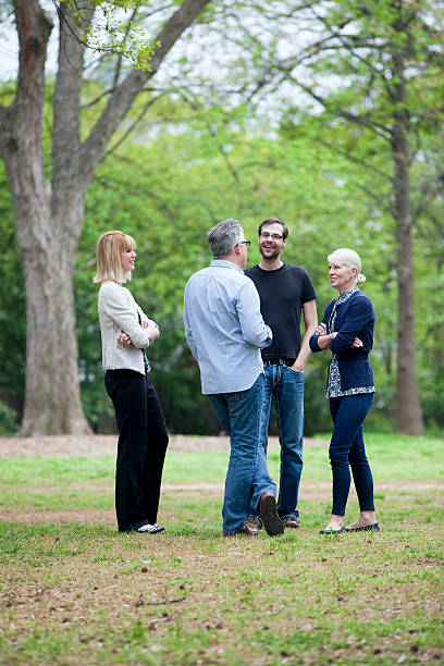 istock Group of People Talking in a Park 471554003
