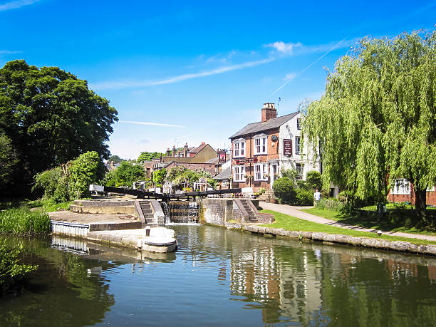 Oxford, UK: May 07, 2014: The Head of the River is a popular gastro pub set on the River Thames at Oxford, providing meals and accommodation. People sit and enjoy a drink with a view in the outdoor beer garden.