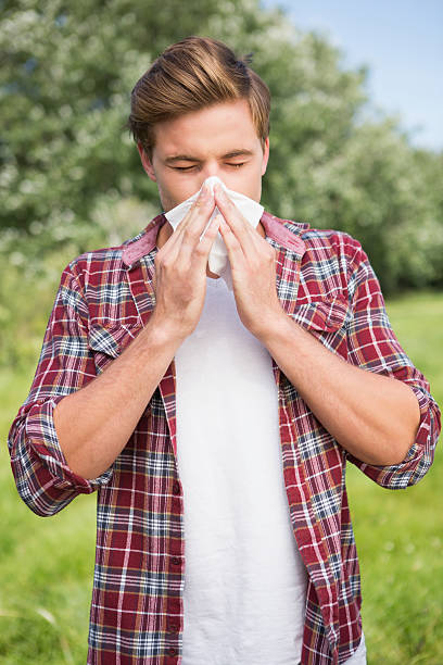 istock Handsome hipster blowing his nose 471555226