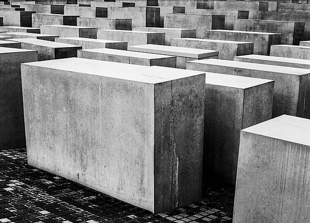 The Memorial to the Murdered Jews of Europe, also known as the Holocaust Memorial, is a memorial in Berlin to the Jewish victims of the Holocaust, designed by architect Peter Eisenman and Buro Happold. The image shows the memorial captured during spring season.