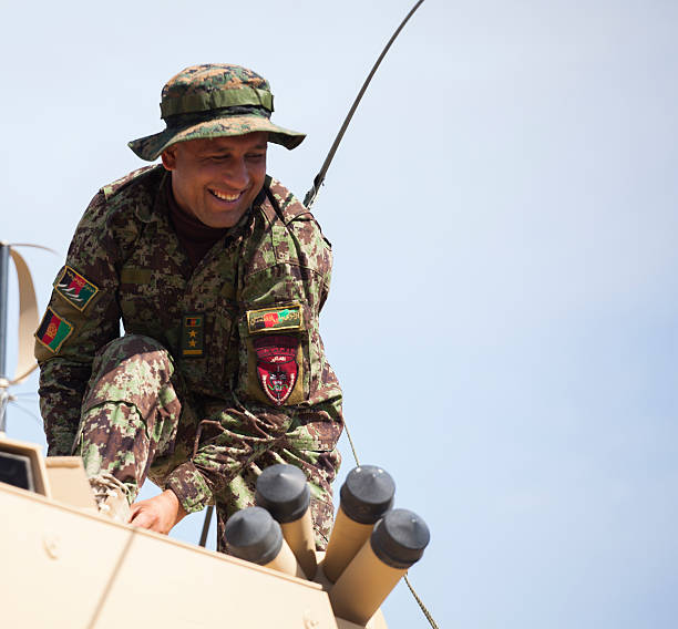 Preparing the Vehicles Kabul, Afghanistan - May 6, 2013: An Afghan National Army (ANA) Soldier, belonging to the 1st MSF (Mobile Strike Force) excutes a task on a MSFV during a class afghanistan army stock pictures, royalty-free photos & images