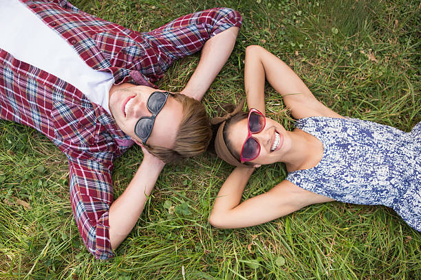 istock Couple relaxing in the park 471556628