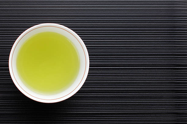 View from looking down into a cup of green tea in a cup
