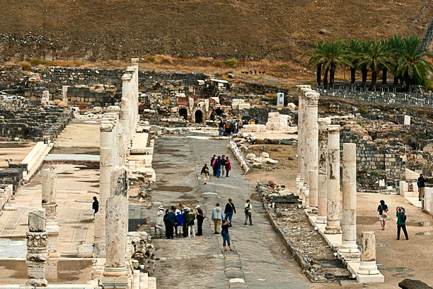 Beit She'an National Park, Israel Beit She'an, Israel, October 28, 2008:Tourists photographing the columns and listening to guides describing remnants of the ancient city. beit she'an stock pictures, royalty-free photos & images