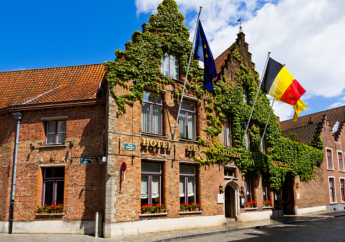 Bruges, Belgium - June 22, 2012: Hotel in historic part of town. Bruges has most of its medieval architecture well preserved and has been designated a UNESCO World Heritage Site. It is the capital and largest city of the province of West Flanders.