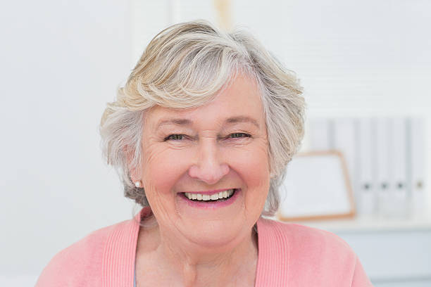 istock Happy female patient in clinic 471557820