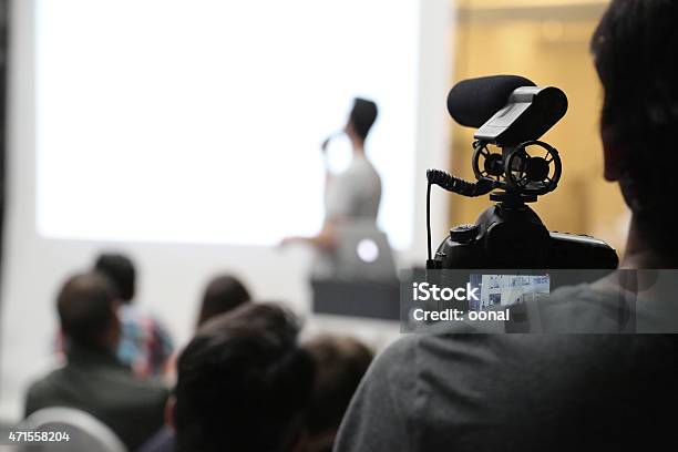 Filming A Preseantation Event Stock Photo - Download Image Now - Filming, Public Speaker, Recording Studio