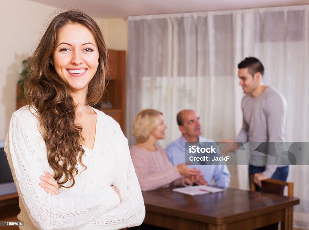 guy and big family with agent Handsome guy and big family with agent at distance indoor 2015 Stock Photo