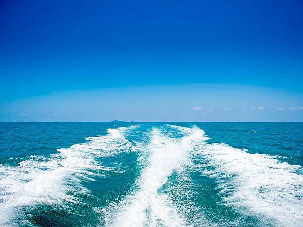 istock trace tails of speed boat on water surface 471559034