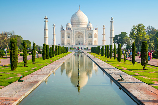 World famous Taj Mahal in Agra, India, classic view with reflections in the water. 