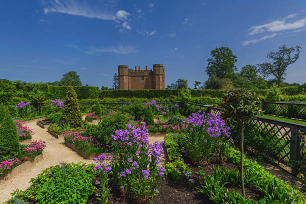 kenilworth castle Kenilworth, UK - June 7, 2013: These are the restored Elizabethan gardens at the popular tourist attraction of Kenilworth Castle in the county of Warwickshire in the English Midlands, England, UK. The gardens have been restored in the Elizabethan style with plants and flowers appropriate to that era. It is polar for people to visit. It is a warm sunny sunny day in Summer.  kenilworth castle stock pictures, royalty-free photos & images