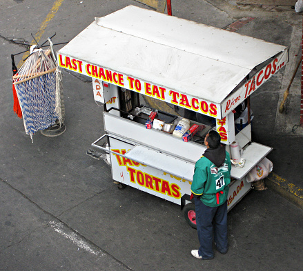 San Ysidro, United States - November 9, 2008: A taco vendor sells food and snacks to people in vehicles waiting to cross the border from Tijuana, Mexico, to San Ysidro, California, which is twenty minutes from San Diego.