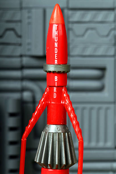 Vancouver, Canada - June 5, 2013: Thunderbird 3, from the Thunderbirds television series, against a mechanical background. The toy is from Matchbox.