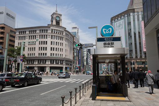 Tokyo, Japan - June 3, 2013 : Pedestrians walk past the Ginza Station in Tokyo, Japan. Ginza Station providing the services for Ginza Line, Marunouchi Line and Hibiya Line. Ginza shopping district, the most expensive real estate price in Japan.