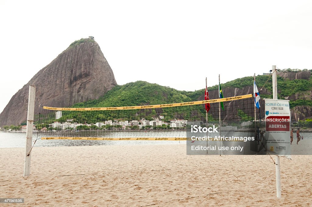 Volleyball/ Footvolley Net, Flamengo Beach, Rio de Janeiro, Brazil Rio de Janeiro, Brazil - November 2, 2012: A Volleyball net on Praia de Flamengo with Sugarloaf Mountain in the background. Activity Stock Photo