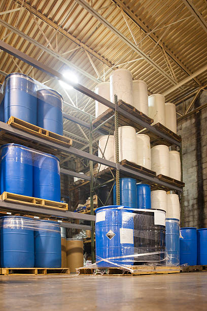 istock 55 Gallon Drums in Chemical Plant Warehouse 471561546