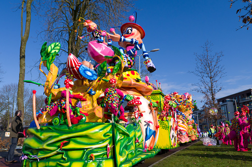 Oldenzaal, Netherlands - February 10, 2013: Decorated wagon with unidentified people  during the annual carnival parade in oldenzaal. It,s one of the largest in the country with 100,000 spectators