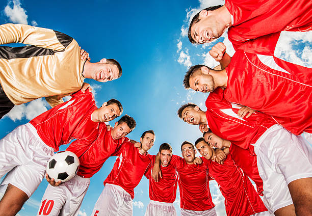 istock Unity of soccer team against blue sky. 471561850