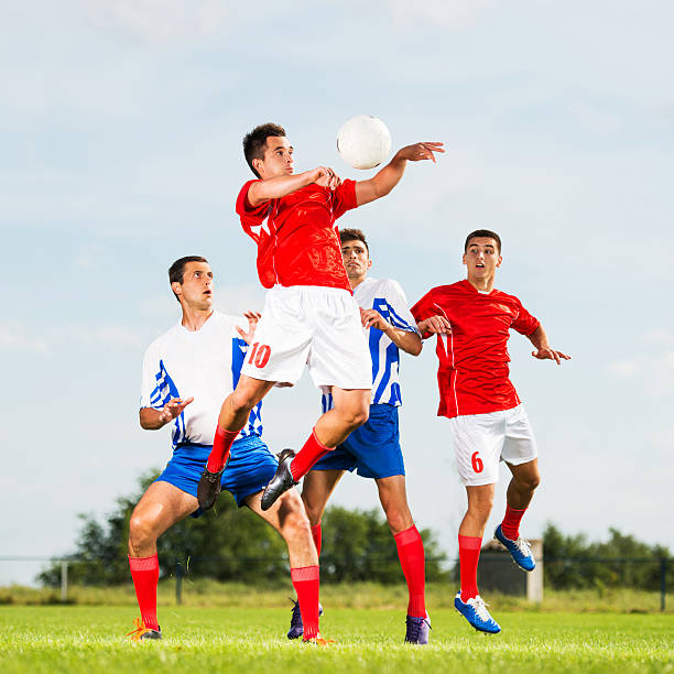 istock Soccer player jumping to head the ball. 471561950