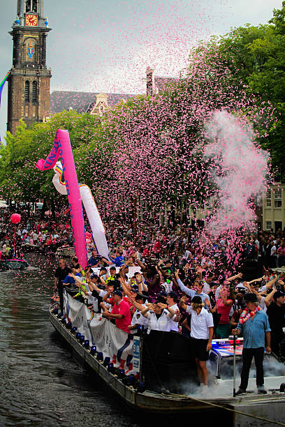 gay pride, amsterdam - city amsterdam urban scene gay parade stock-fotos und bilder