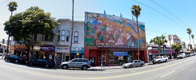 San Francisco, California, United States- June 6, 2013: Panorama of Mission St. and 25th in San Francisco. Locals and tourists mingling in the diverse Mission District community.
