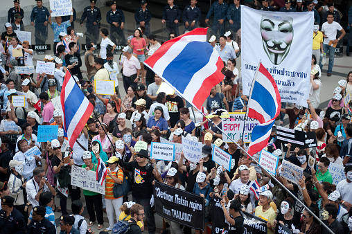 Bangkok,Thailand-June 9,2013 : Unidentified demonstrators from the anti- government  V for Thailand group wearing  Guy Fawkes masks attend rally outside a shopping mall on June 9,2013 in Bangkok,Thailand.