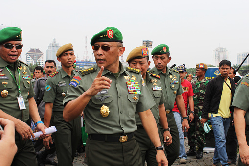 Jakarta, Indonesia-October 06, 2012: Chief of staff of the army, General Pramono Edhi Wibowo is reviewing military army weapons exhibition in the national monument.