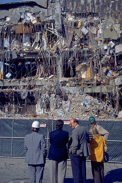 Assessing the Northridge Earthquake Aftermath Northridge, California - January 19, 1994: Experts survey office building with one side entirely collapsed from the Martin Luther King Day earthquake. martin luther king jr day stock pictures, royalty-free photos & images