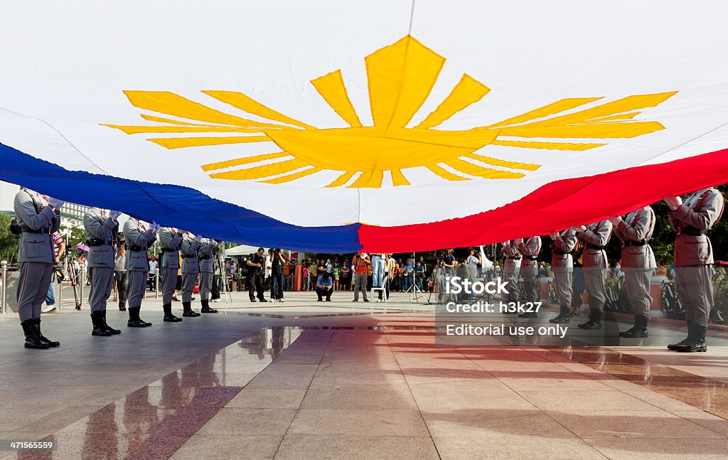 Biggest Philippine Flag Luneta Park, Philippines -June 12, 2013: Raising the Philippine flag lead by Philippines Vice President Jejomar Binay and Major General Essel Soriano, vice commander of Philippine Army during the ceremonies marking the 115th Independence Day of the country from the colonial rule of spain since 1898 in Cavite, Philippines. Flag Stock Photo
