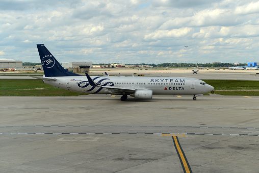 Detroit, MI, USA - June 8, 2013: A Delta Airlines Boeing 737-832 (registration N3758Y) in Skyteam livery taxiing for takeoff at Detroit Wayne County Metropolitan Airport (DTW). The airliner was repainted in 2012 to advertise that Delta is part of the Skyteam alliance of 19 airlines worldwide.