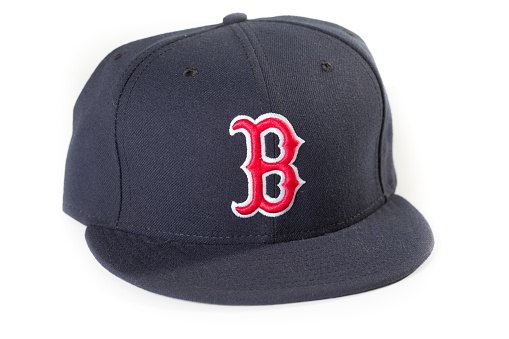 New York, USA - November 22, 2012: Boston Red Sox baseball cap. The Boston Red Sox are a professional baseball team based in Boston, Massachusetts, and a member of Major League Baseball's American League Eastern Division.
