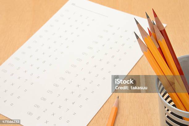 A Sheet With Multiplications On And A Pot Of Pencils Stock Photo - Download Image Now